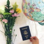 Still life with flowers globe and US passport
