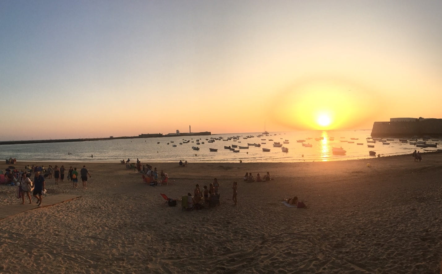 Sunset over Spanish harbor taken from beach