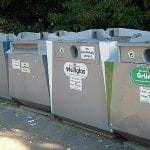 Five grey bins that are used for trash and recycling separation in Germany
