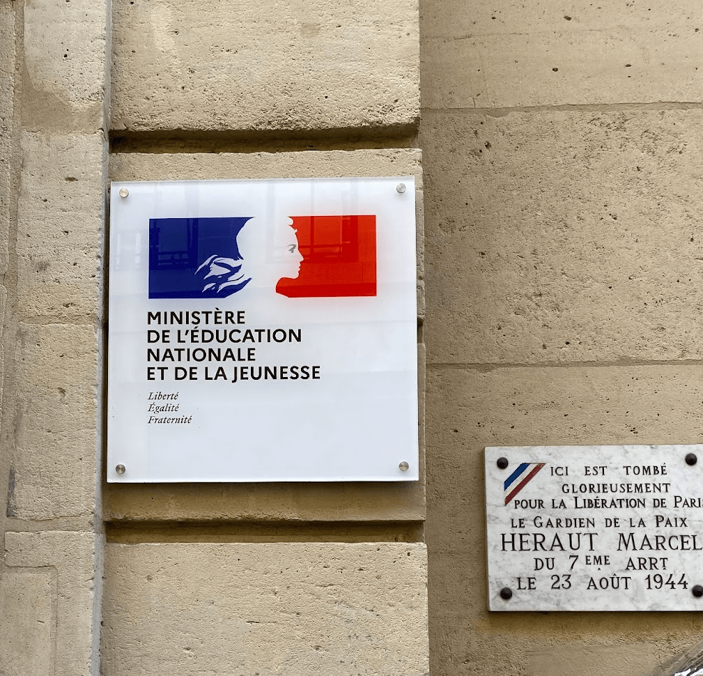 The Ministry of National Education and Youth plaque outside of the office building