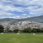 Image shows the green-ness of Quito with the city off in the distance.