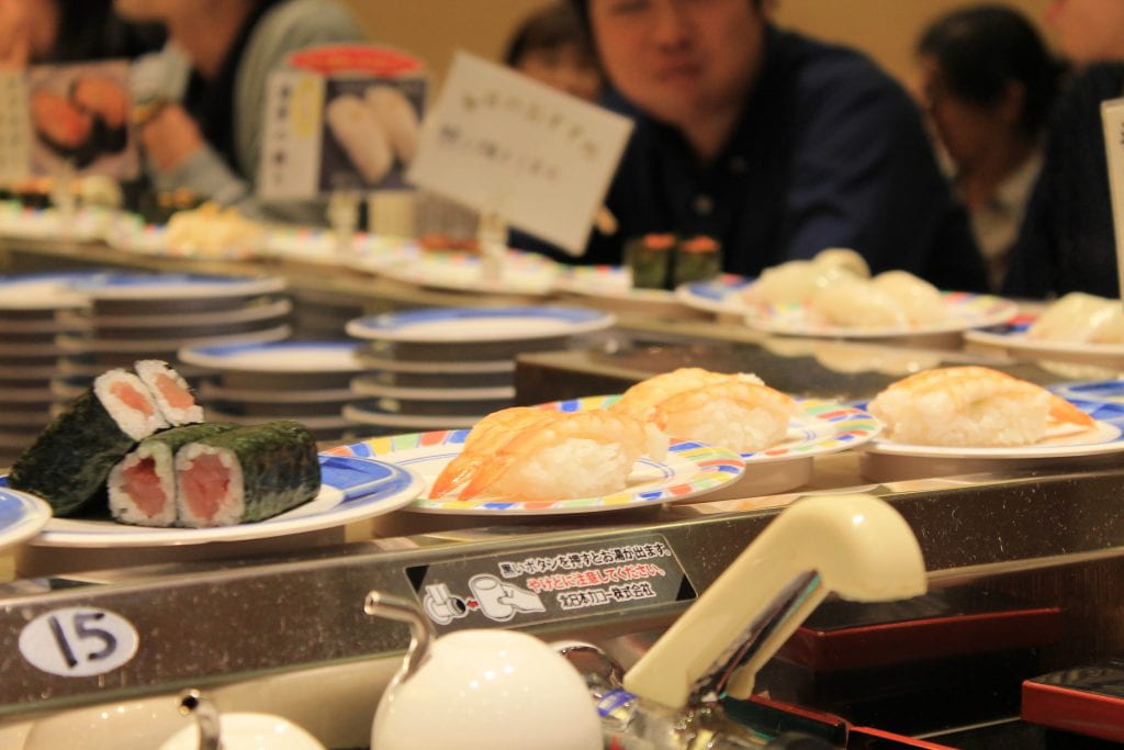 Kaitensushi! Just pick a plate off of the conveyor belt and eat away!