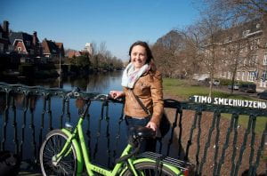 Raizel on canal bridge in Amsterdam