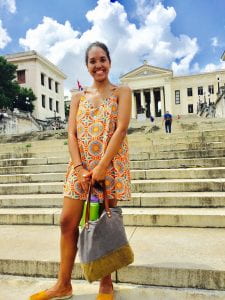 Bella standing on steps of University of Havana