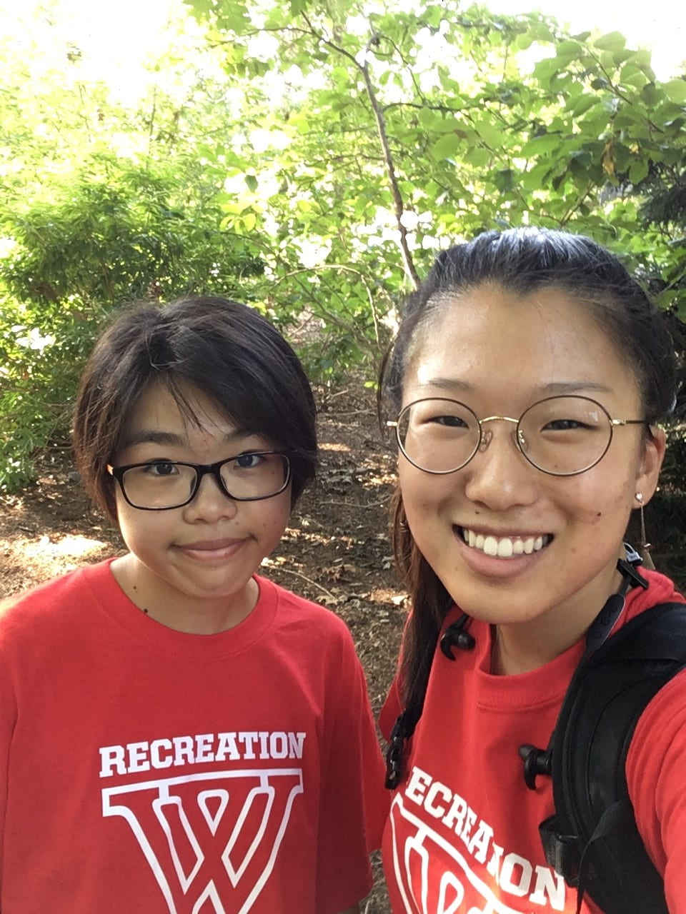 Emily with her friend and exchange student from Smith, both wearing red shirts with a large W