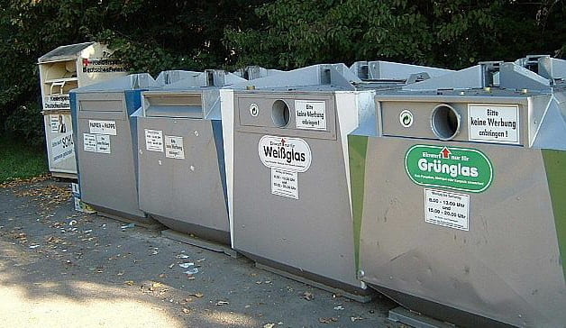 Five grey bins that are used for trash and recycling separation in Germany