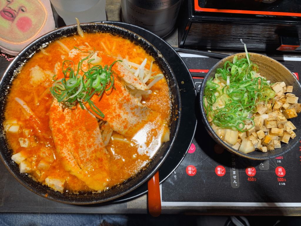 A huge bowl of ramen with a char siu pork bowl.